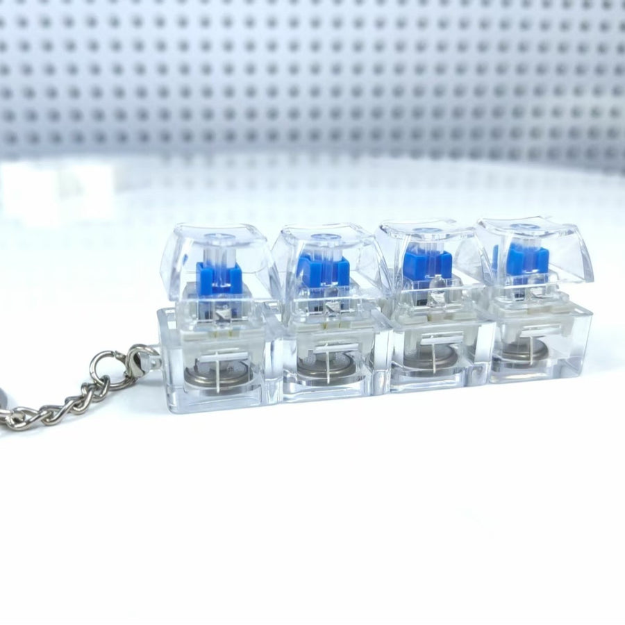 4-Key Luminous Keycap Keychain – Anti-Stress Clicker Toy